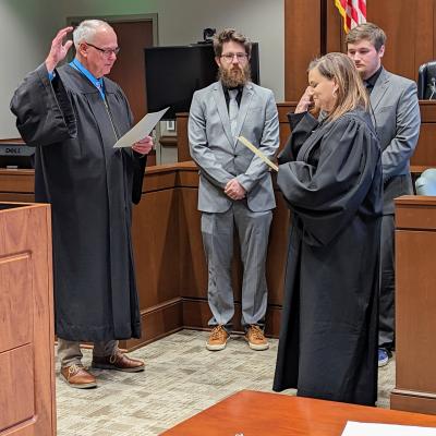 Tiffin-Foatoria Municipal Court Judge Rhonda Best (right) is sworn in by Seneca County Common Pleas Court Judge Michael P. Kelbley.