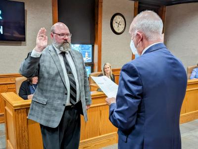 John Spahr Jr. (left) is sworn into office Monday evening as the newest At-Large Council member by Law Director Brent Howard.