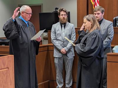 Tiffin-Foatoria Municipal Court Judge Rhonda Best (right) is sworn in by Seneca County Common Pleas Court Judge Michael P. Kelbley.