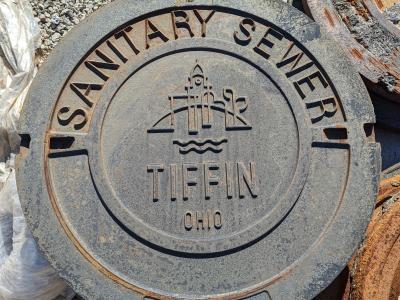  Examples of sanitary sewer manhole covers located at the Tiffin Public Works garage.