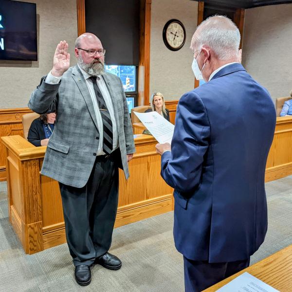 John Spahr Jr. (left) is sworn into office Monday evening as the newest At-Large Council member by Law Director Brent Howard.