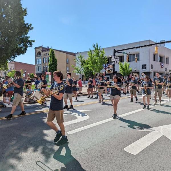 Members of the Tiffin Columbian Marching Band are seen on Washington Street during the 2022 Memorial Day Parade in Downtown Tiffin.